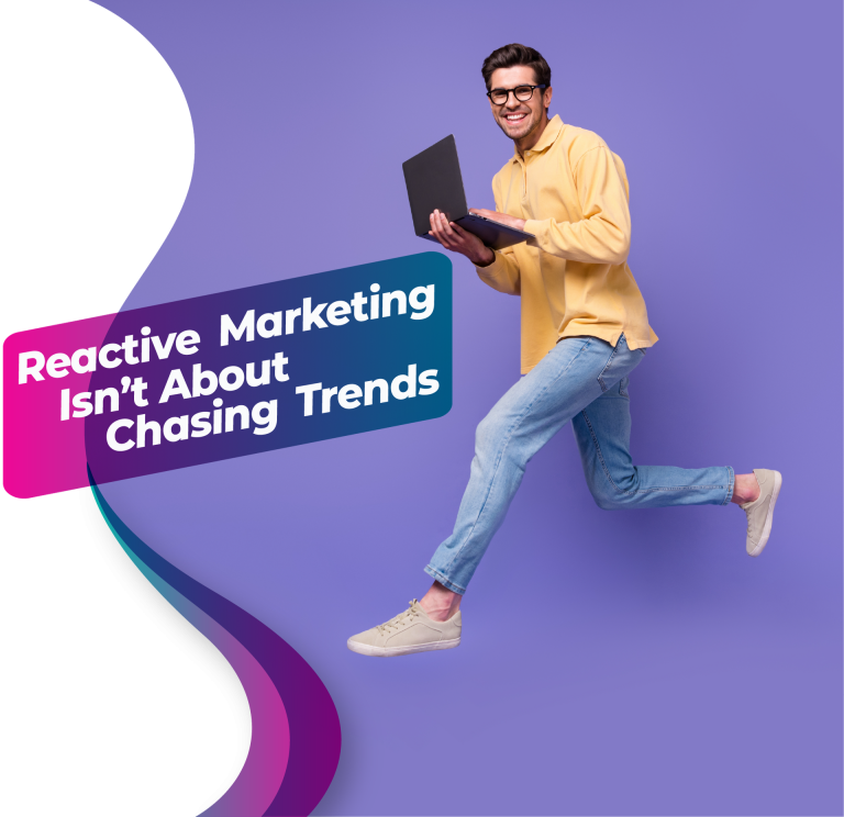 Marketer jumping with a laptop representing fast-paced reactive marketing and real-time content creation.